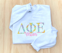 Delta Phi Epsilon "Mom" Floral White Sweatshirt